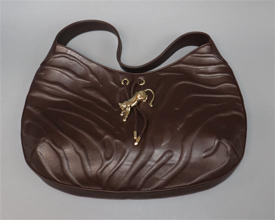 A Cartier Panthere textured brown leather shoulder bag, with signature gold-toned panther decoration to front